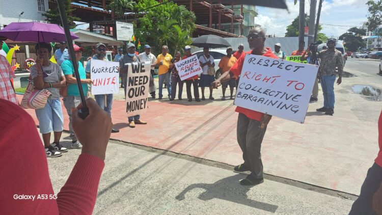 Union leaders protest in solidarity with teachers, in front of the Ministry of Education, June 6, 2024 (center GTUC President Norris Witter)