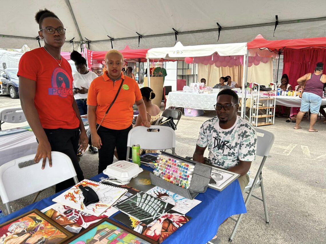 Artist plying his trade during the Town Week Celebration (Facebook photo)