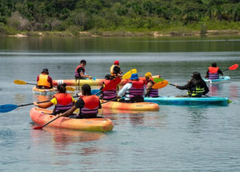 Persons participating in kayaking