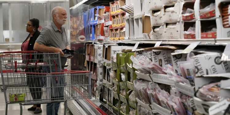 Customers select goods at a supermarket in Foster City, California, the United States, April 10, 2024. (Photo by Li Jianguo/Xinhua)
