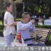 Zhang Ji takes a photo. (Screengrab/CCTV News app)