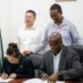Permanent Secretary of the Office of the Prime Minister, Alfred King and Chief Representative of Power China, Dan Shen signing the contract for the construction of the National Control Centre building