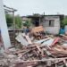 Displaced residents of Sarah Johanna looking on at what's left of their homes which was demolished Friday under the watchful eyes of the police