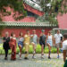 Tourists from Italy pose for a photo after an introduction to tai chi, or taijiquan, at the Temple of Heaven in Beijing on July 9 (XINHUA)