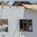 A man looks out of the window of his home, which was destroyed by Hurricane Beryl in Clifton, Union Island, St. Vincent and the Grenadines, Thursday, July 4, 2024. (AP Photo/Lucanus Ollivierre)