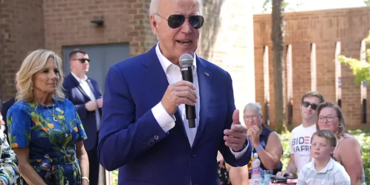 President Joe Biden speaks to supporters as first lady Jill Biden, left, looks on at a campaign rally in Harrisburg, Pa., on Sunday, July 7, 2024. (AP Photo/Manuel Balce Ceneta)