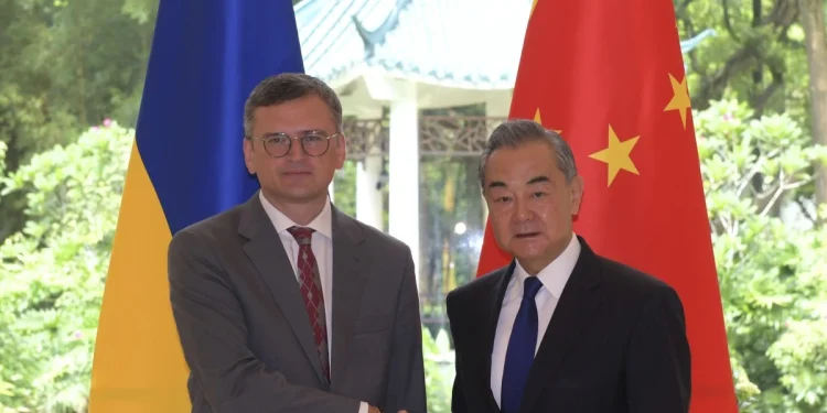 Ukrainian Foreign Minister Dmytro Kuleba (left) poses with Chinese counterpart Wang Yi on Wednesday at Guangzhou’s Pine Garden, a former residence of Chinese President Xi Jinping’s father and a venue used to host important officials. Photo: Xinhua via AP