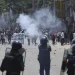 Students clash with riot police during a protest against a quota system for government jobs, in Dhaka, Bangladesh, Thursday, July 18, 2024. (AP Photo/Rajib Dhar)
