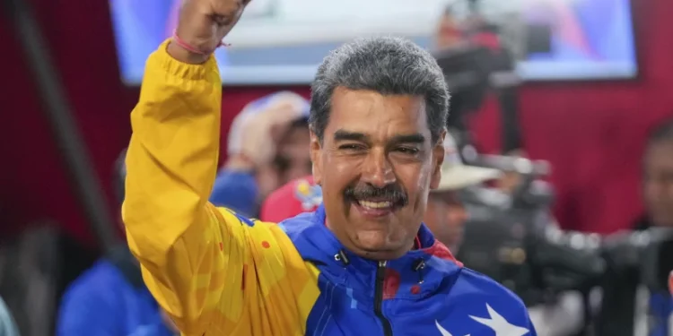 President Nicolas Maduro addresses supporters after electoral authorities declared him the winner of the presidential election in Caracas, Venezuela on Monday.
Fernando Vergara/AP