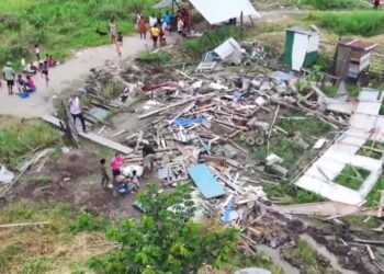 Displaced residents of Sarah Johanna looking on at what's left of their homes which was demolished Friday under the watchful eyes of the police (July 2024)