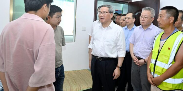 Chinese Premier Li Qiang, also a member of the Standing Committee of the Political Bureau of the Communist Party of China Central Committee, visits a relocation site in Zhoumensi Town of Zixing City, central China's Hunan Province, Aug. 1, 2024. Li visited disaster-hit residents and inspected flood-control work on Thursday in Chenzhou, central China's Hunan Province. (Xinhua/Yue Yuewei)