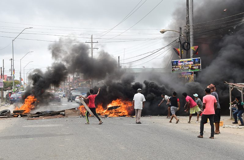 PPP/C supporters blocking the main access road at Bush Lot  on March 6, 2020 protesting 2020 Elections (Guyana Chronicle photo)