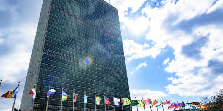 A view of the Secretariat building with flags of Member States in the foreground, at UN Headquarters. UN Photo/Manuel Elias UN Photo/Manuel Elias