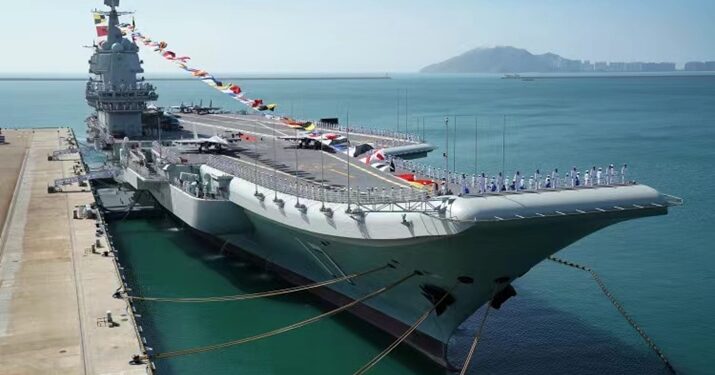 File photo taken on December 17, 2019 shows the Shandong aircraft carrier at a naval port in Sanya, south China's Hainan Province. China's first domestically built aircraft carrier, the Shandong, was delivered to the People's Liberation Army (PLA) Navy and placed in active service on December 17 at a naval port in Sanya. The new aircraft carrier, named after Shandong Province in east China, was given the hull number 17 (XINHUA)