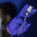 FILE - Family nurse practitioner Carol Ramsubhag-Carela prepares a syringe with the Mpox vaccine before inoculating a patient at a vaccinations site on, August 30, 2022, in the Brooklyn borough of New York. (AP Photo/Jeenah Moon, File)