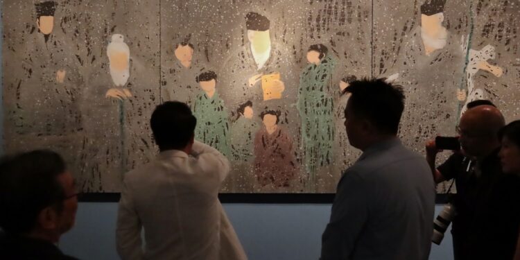 Yuan Xiaolou's exhibition at the National Museum of China demonstrates his exploration of mineral pigments to convey the cultural spirit of the country.[Photo by Jiang Dong/China Daily]