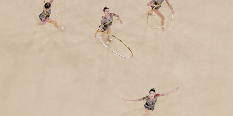 Athletes of China compete during group all-round final of rhythmic gymnastics at the Paris 2024 Olympic Games in Paris, France, Aug 10, 2024. [Photo/Xinhua]