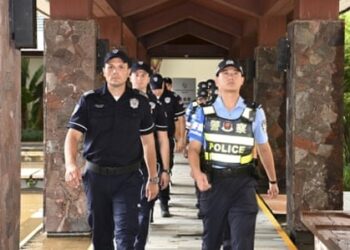 Serbian and Chinese police officers carry out a joint patrol in Sanya, south China's Hainan province, on 7 September. China plans to train thousands of foreign law enforcement officers. Photograph: Xinhua/REX/Shutterstock
