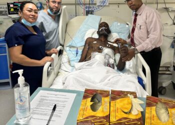 The patient and members of the Hospital team