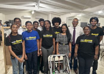 Minister Frank Anthony (white shirt) flanked by STEMGuyana team