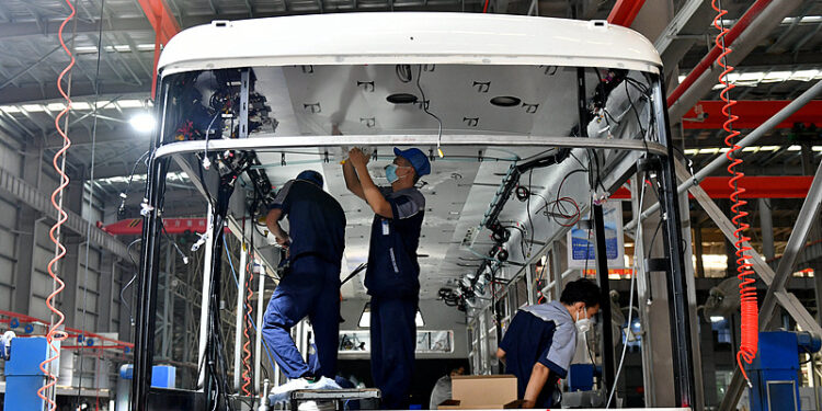 Workers at a new energy vehicle production workshop in Zhangzhou, Fujian Province, China, Nov 6, 2023. /CFP