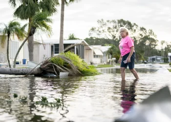 A woman walks along a flooded street in the aftermath of Hurricane Milton in Osprey, Florida. The hurricane made landfall as a Category 3 hurricane in the Siesta Key area.
Sean Rayford/Getty Images