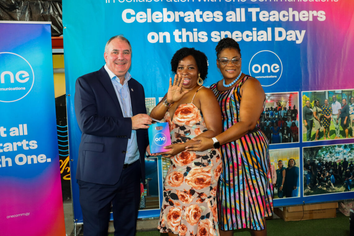 One Communications CEO Damian Blackburn and GT General Secretary Coretta McDonald flank teacher at One Special Teacher breakfast event.