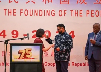 President, Dr Mohamed Irfaan Ali and Chinese Ambassador to Guyana, Guo Haiyan tossing at the 75th Anniversary of the Founding of the People’s Republic of China