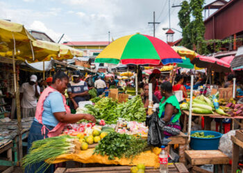 Vendors sell produce at Stabroek market in Georgetown, capital city of Guyana, South America.