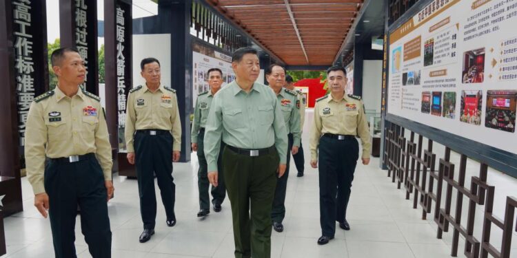 Chinese President Xi Jinping, also general secretary of the Communist Party of China Central Committee and chairman of the Central Military Commission, learns about the history of a brigade, on Oct. 17, 2024. Xi inspected a brigade of the Chinese People's Liberation Army Rocket Force on Thursday. (Xinhua/Li Gang)
