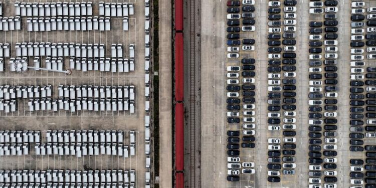An aerial drone photo shows vehicles to be transported at a railway station of CRIntermodal in Wuhan, central China's Hubei Province, Nov. 16, 2024. (Xinhua/Xing Guangli)