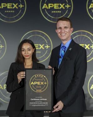 Christina de Sousa Caribbean Airlines Manager, Customer Attention, accepts award on behalf of the airline.
