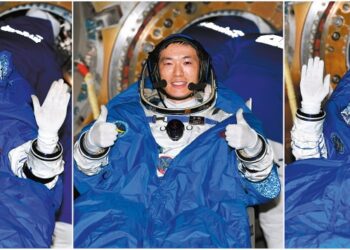 Shenzhou XVIII mission commander Senior Colonel Ye Guangfu (left) and crew members Lieutenant Colonel Li Cong (middle) and Lieutenant Colonel Li Guangsu wave and cheer during a live program early Monday morning soon after the spaceship's reentry capsule touched down at the Dongfeng Landing Site in the Inner Mongolia autonomous region. WANG JIANGBO/FOR CHINA DAILY