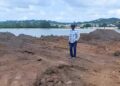 Alister Thomas, United Progressive Party (UPP) Caretaker in the constituency of St. Johns City West perusing the dump site for the excavations from the Bethel cemetery.