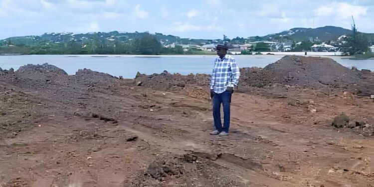 Alister Thomas, United Progressive Party (UPP) Caretaker in the constituency of St. Johns City West perusing the dump site for the excavations from the Bethel cemetery.