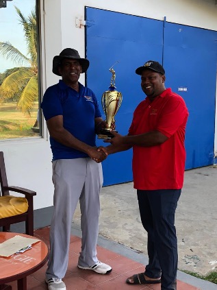 C.E.O OF ODYSSEY SIGHTSEEING TOURS MR. FEROZE BARAKAT PRESENTING 
WINNING TROPHY TO MR. DAVID WILSON CAPTAIN OF LUSIGNAN VILLAGERS