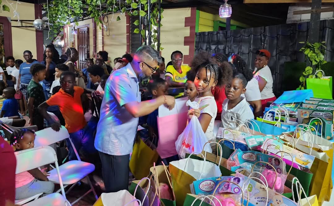Former City Mayor Pt. Ubraj Narine distributing gifts