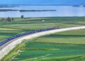 An aerial drone photo shows a train for China-Europe freight service pulling out of Tongjiang North Railway Port in northeast China's Heilongjiang Province, on August 9, 2024 (XINHUA)