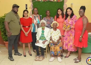 Minister of Human Services and Social Security, Dr Vindhya Persaud and members of the ministry alongside two centenarians at the launch of the Golden Generations Hubs