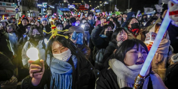 Protesters celebrate the impeachment of South Korean president Yoon Suk Yeol following his decision to impose a martial law, in front of National Assembly on Dec.14, 2024, in Seoul, South Korea.Woohae Cho / Getty Images