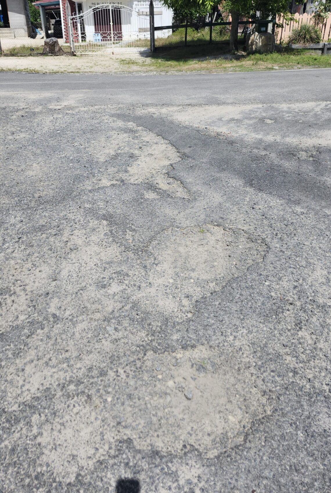 Suddie Housing Schemes-the damaged is in the scheme built during Burnham government. The repaved road is the housing development during the PPP government.