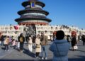Tourists from Britain pose for a photo at Tiantan (Temple of Heaven) Park in Beijing, capital of China, Dec. 5, 2024. (Xinhua/Ju Huanzong)
