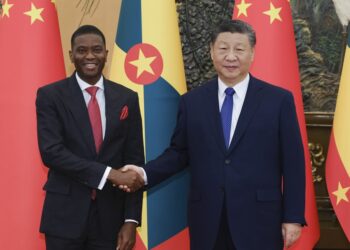 Chinese President Xi Jinping (R) shakes hands with Prime Minister of Grenada Dickon Mitchell in Beijing, China, January 13, 2025. /Xinhua