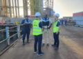 Minister of Home Affairs Robeson Benn at the site of the new bridge today as search efforts continued. (Ministry of Home Affairs photo)