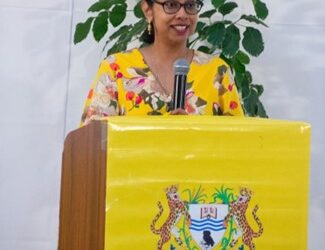 Dr Taijrani Rampersaud-Skorka, a University of Guyana alumna and current lecturer at the Centre for Communication Studies (CCS), addresses attendees during the launch of her book at the Turkeyen Campus.