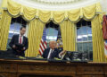 President Donald Trump signs an executive order withdrawing the U.S. from the World Health Organization in the Oval Office of the White House, Monday, Jan. 20, 2025, in Washington. (AP Photo/Evan Vucci)