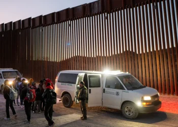 Migrants turn themselves in to US Customs and Border Patrol officers after crossing over a section of border wall into the US on January 5, 2025 in Ruby, Arizona. Brandon Bell/Getty Images