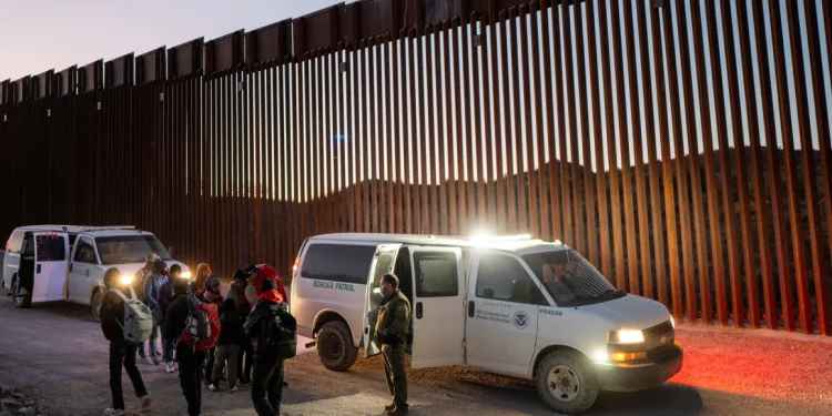 Migrants turn themselves in to US Customs and Border Patrol officers after crossing over a section of border wall into the US on January 5, 2025 in Ruby, Arizona. Brandon Bell/Getty Images