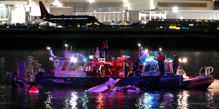 Emergency divers respond after a passenger aircraft collided with a helicopter, in the Potomac River near Ronald Reagan Washington Airport on Jan. 30, 2025 in Arlington, Virginia. (Photo by Andrew Harnik/Getty Images)