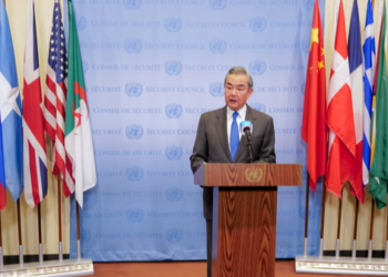 China's Foreign Minister Wang Yi speaks to the press following a meeting of the United Nations Security Council at the U.N. headquarters in New York City, U.S., February 18, 2025. REUTERS/Brendan McDermid Purchase Licensing Rights